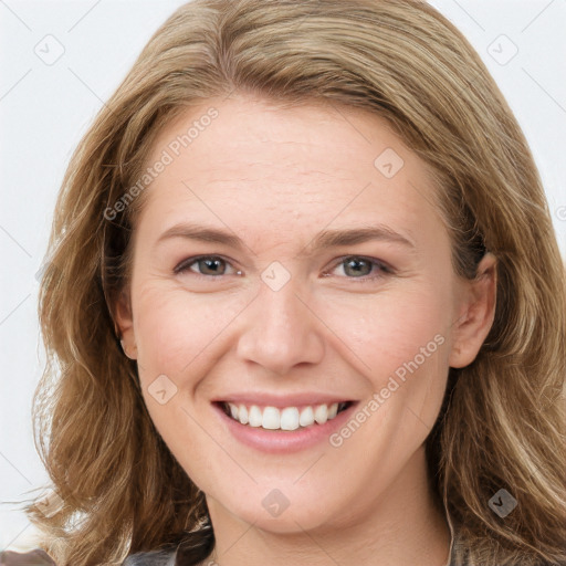 Joyful white young-adult female with long  brown hair and blue eyes