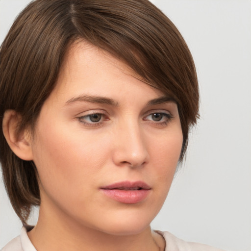 Neutral white young-adult female with medium  brown hair and brown eyes