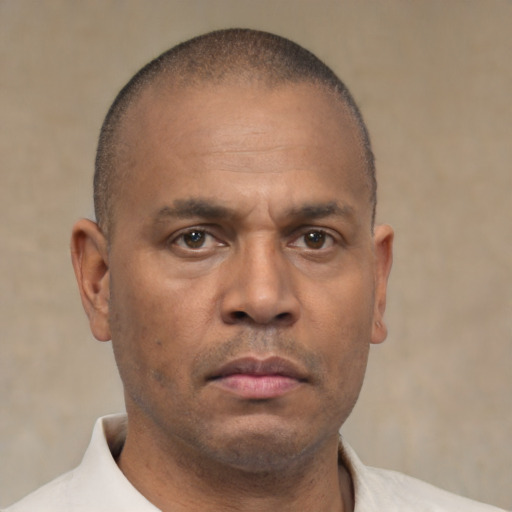 Neutral latino adult male with short  brown hair and brown eyes