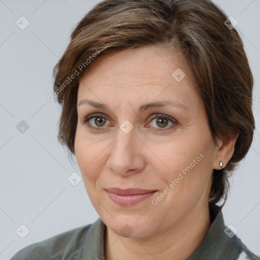 Joyful white adult female with medium  brown hair and brown eyes