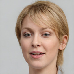 Joyful white young-adult female with medium  brown hair and blue eyes