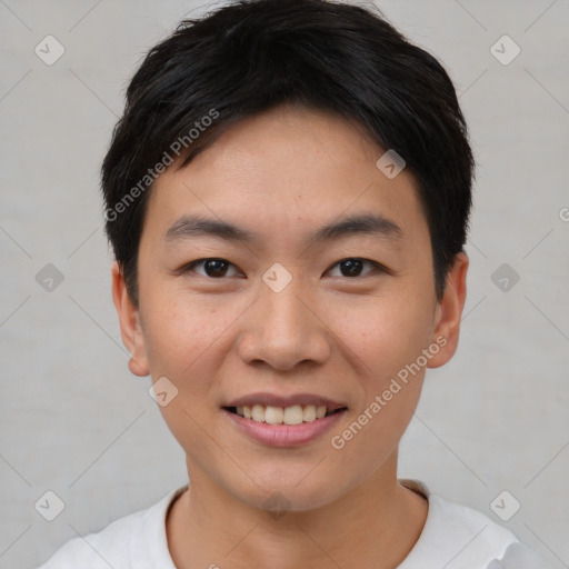 Joyful asian young-adult male with short  brown hair and brown eyes