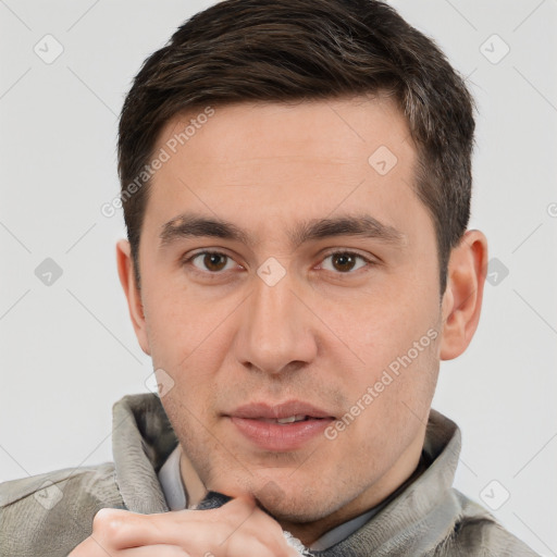 Joyful white young-adult male with short  brown hair and brown eyes