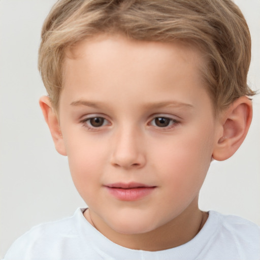 Joyful white child male with short  brown hair and brown eyes