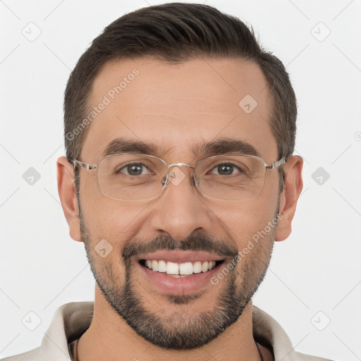 Joyful white adult male with short  brown hair and brown eyes