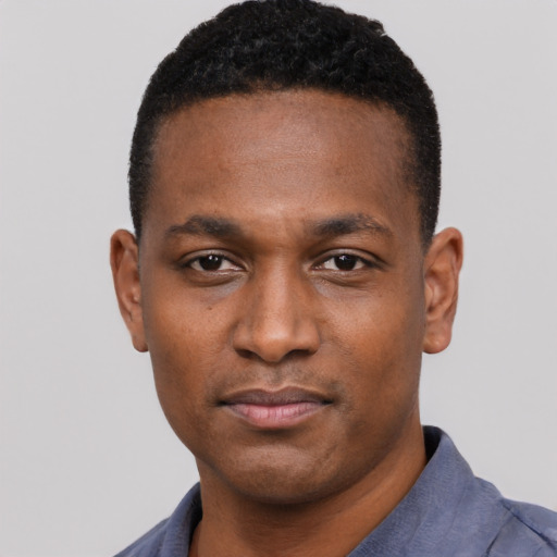 Neutral black young-adult male with short  black hair and brown eyes