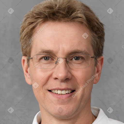 Joyful white adult male with short  brown hair and grey eyes