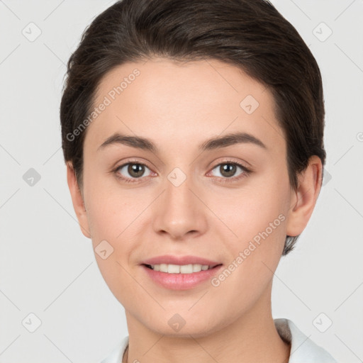 Joyful white young-adult female with short  brown hair and brown eyes