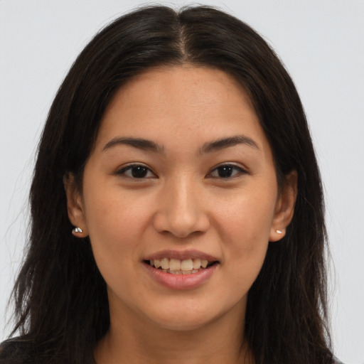 Joyful white young-adult female with long  brown hair and brown eyes