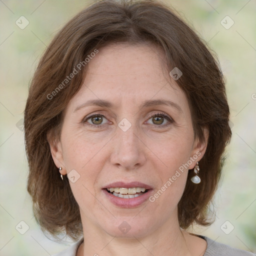 Joyful white adult female with medium  brown hair and grey eyes