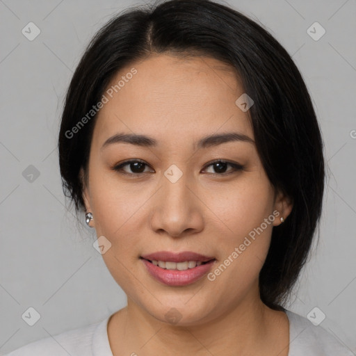 Joyful asian young-adult female with medium  black hair and brown eyes