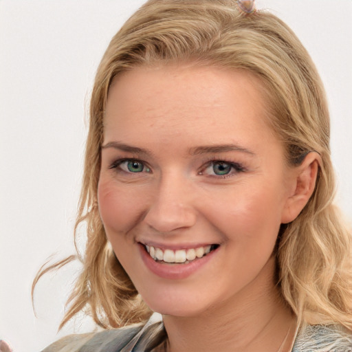 Joyful white young-adult female with medium  brown hair and blue eyes