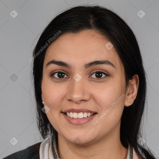 Joyful white young-adult female with long  brown hair and brown eyes