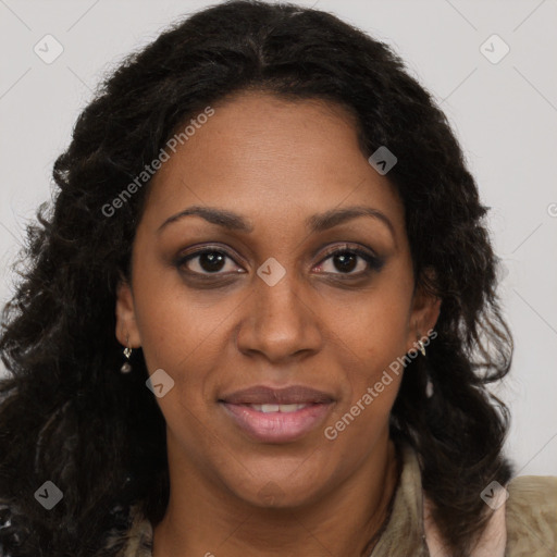 Joyful black adult female with long  brown hair and brown eyes