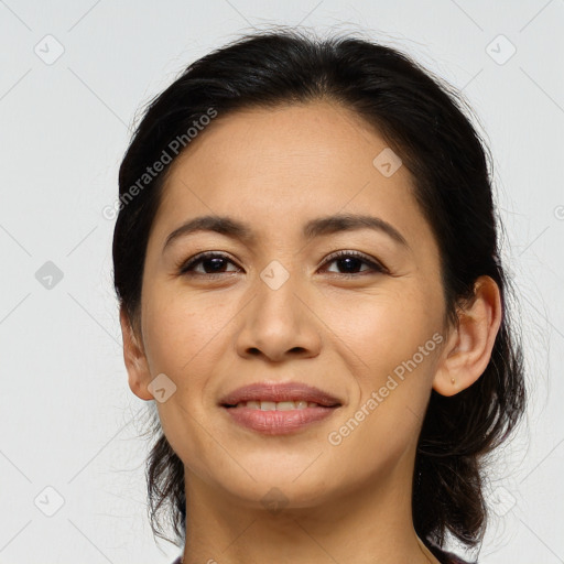 Joyful asian young-adult female with long  brown hair and brown eyes