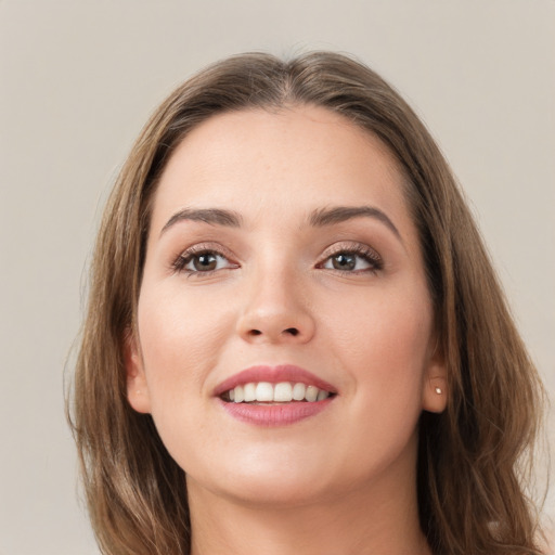 Joyful white young-adult female with long  brown hair and grey eyes