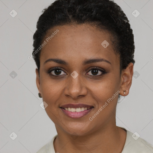 Joyful black young-adult female with short  black hair and brown eyes