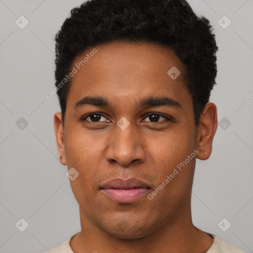 Joyful black young-adult male with short  black hair and brown eyes