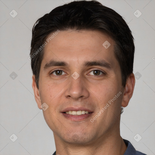 Joyful white young-adult male with short  black hair and brown eyes