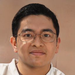 Joyful asian young-adult male with short black hair and brown eyes