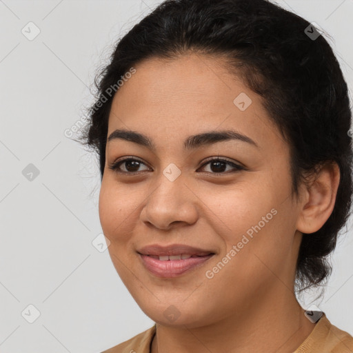 Joyful latino young-adult female with long  brown hair and brown eyes