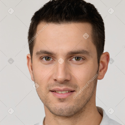 Joyful white young-adult male with short  brown hair and brown eyes