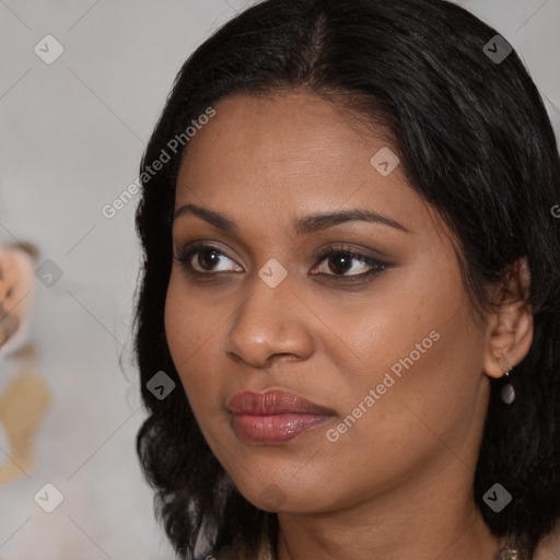 Joyful black young-adult female with medium  brown hair and brown eyes