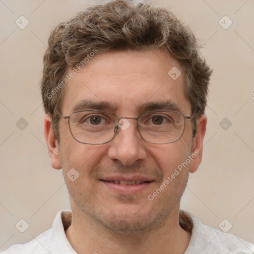 Joyful white adult male with short  brown hair and grey eyes