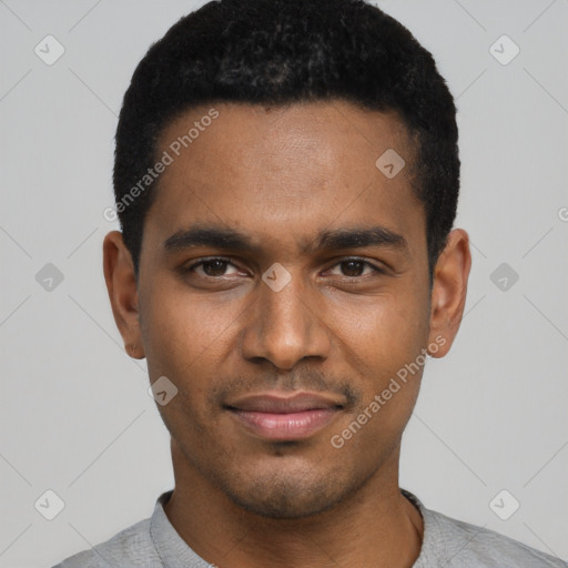 Joyful black young-adult male with short  black hair and brown eyes