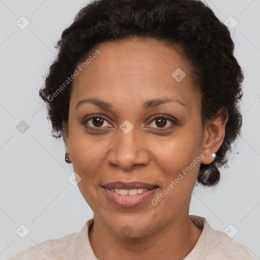 Joyful latino adult female with short  brown hair and brown eyes