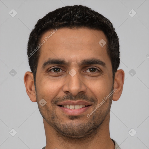 Joyful latino young-adult male with short  black hair and brown eyes