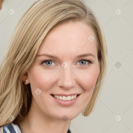 Joyful white young-adult female with long  brown hair and blue eyes