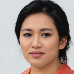 Joyful asian young-adult female with medium  black hair and brown eyes