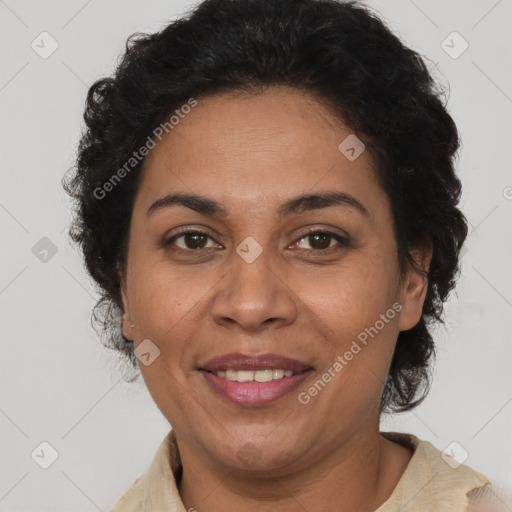 Joyful latino adult female with short  brown hair and brown eyes