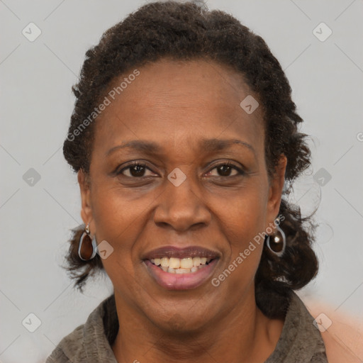 Joyful black adult female with medium  brown hair and brown eyes