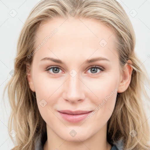 Joyful white young-adult female with long  brown hair and blue eyes