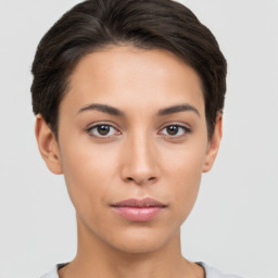 Neutral white young-adult female with short  brown hair and brown eyes