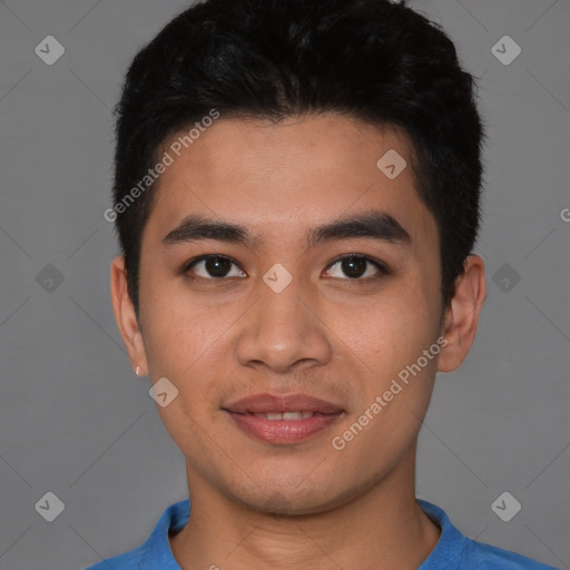 Joyful asian young-adult male with short  brown hair and brown eyes