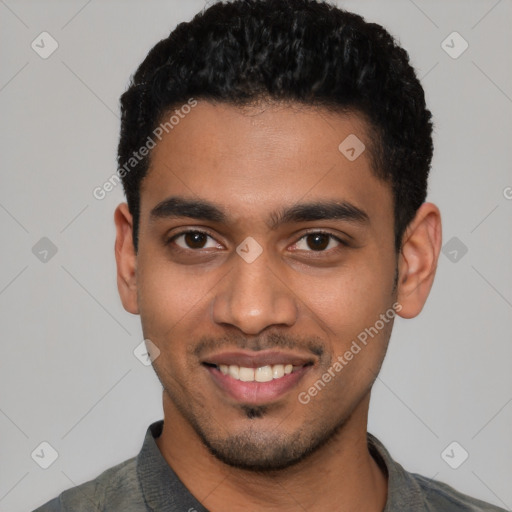 Joyful latino young-adult male with short  black hair and brown eyes