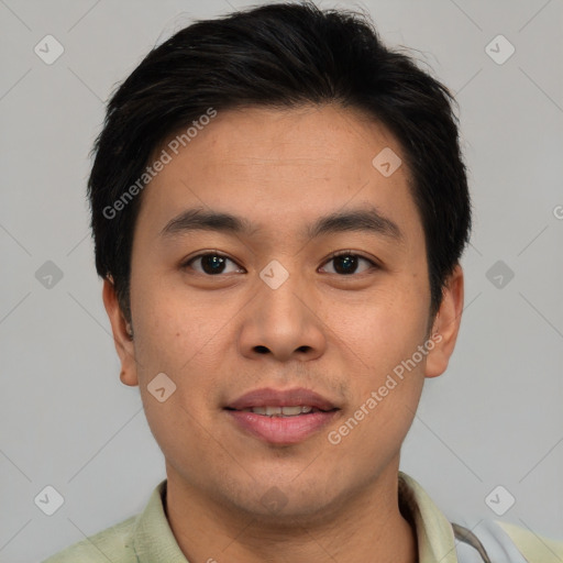 Joyful asian young-adult male with short  brown hair and brown eyes