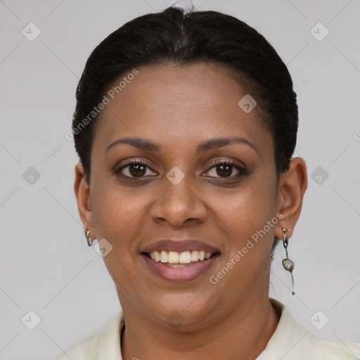 Joyful black young-adult female with short  brown hair and brown eyes