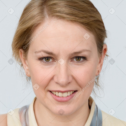 Joyful white adult female with medium  brown hair and blue eyes