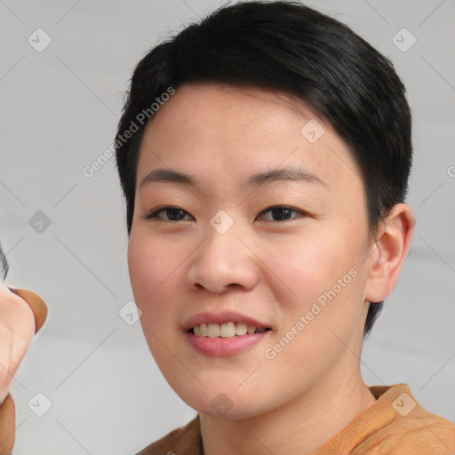 Joyful asian young-adult female with short  black hair and brown eyes