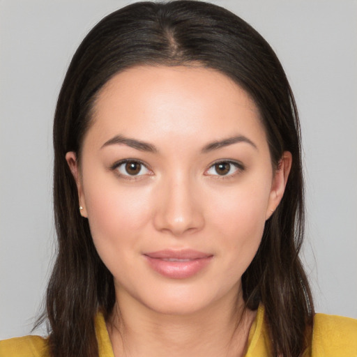 Joyful white young-adult female with long  brown hair and brown eyes