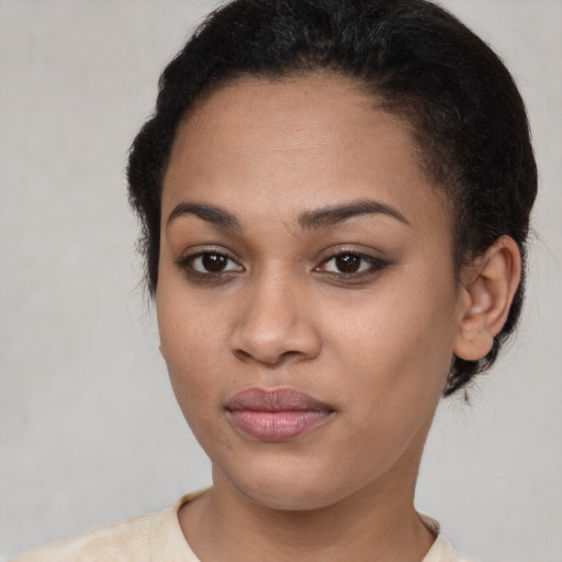 Joyful latino young-adult female with short  brown hair and brown eyes