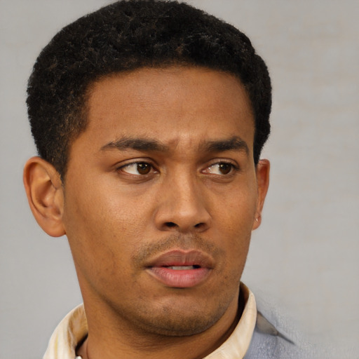 Neutral latino young-adult male with short  brown hair and brown eyes