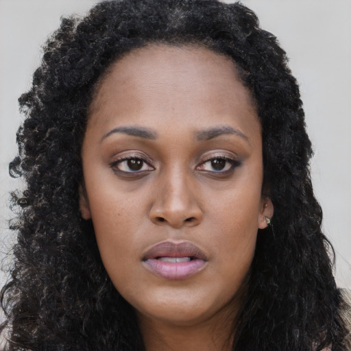 Neutral black young-adult female with long  black hair and brown eyes