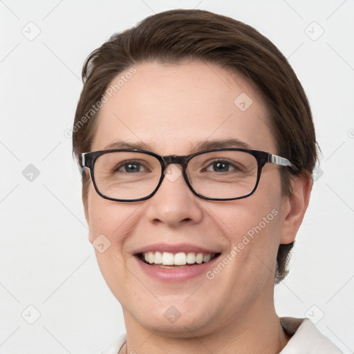 Joyful white young-adult female with short  brown hair and blue eyes