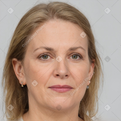 Joyful white adult female with medium  brown hair and grey eyes