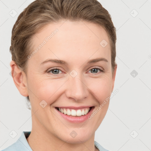 Joyful white young-adult female with short  brown hair and grey eyes